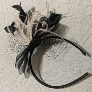 Black netting fascinator with black and pale pink feathers